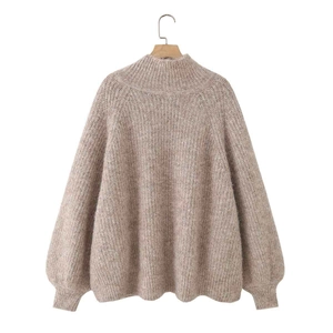 Oversized oatmeal knit sweater featuring mock neck design and puff sleeves for women