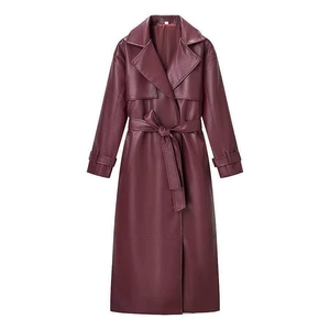 Women's long burgundy faux leather trench coat with waist belt and lapel collar