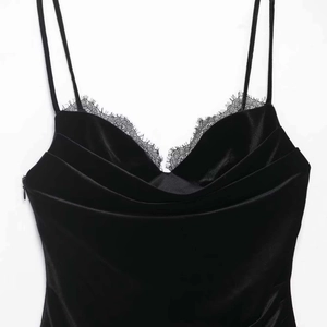 Chic black velvet slip dress with deep V-neck and delicate eyelash lace trim details