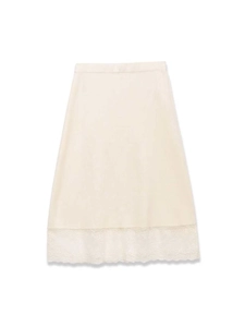 Close-up of ivory lace hem on lightweight midi petticoat with elastic waist