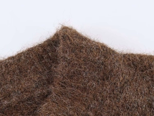 Close-up of deep brown thick wool plush fabric showing soft mohair texture and fibers
