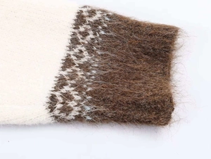 Detail of vintage jacquard knit cuffs featuring soft mohair fibers and geometric wave patterns