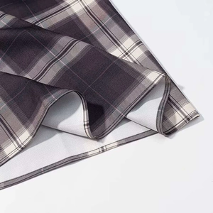 Plaid pleated skirt in grey and black check pattern with high-quality stitching detail