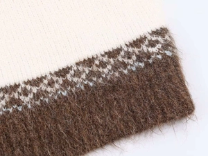 Detail of soft mohair knit fabric with vintage jacquard pattern and fuzzy texture