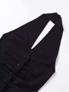 Close-up of black knit halter neck top showing V-neckline and button-up detailing