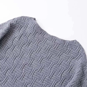 Short grey knit sweater with geometric jacquard texture and premium ribbed collar detail
