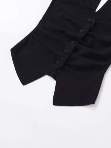Close-up of black V-neck tank top featuring detailed button placket and pleated fabric texture