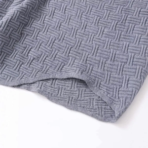 Short grey knit sweater with geometric jacquard pattern and premium woven texture