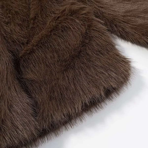 Deep brown faux fur jacket with fluffy texture and plush finish for winter warmth