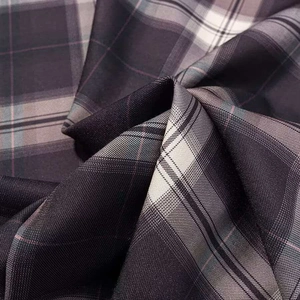 Detailed close-up of dark grey plaid fabric showing soft pleats and fine texture