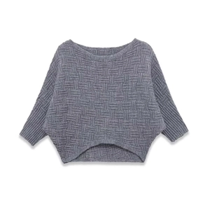 Women's gray chunky knit sweater featuring batwing sleeves and geometric textured patterns