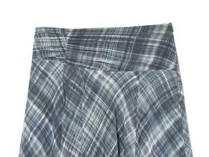 Detail of waist pleats and blue-white plaid fabric texture on the summer midi skirt
