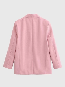 Rear view detail of the pink blazer jacket showing the back slit and tailored seam
