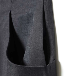 Dark grey high-waisted wide leg trousers with textured twill fabric and pleats