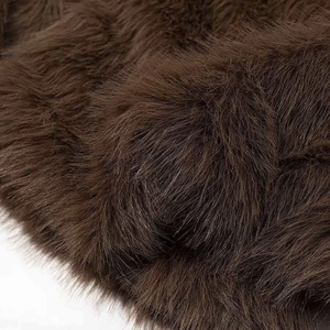 Close-up of premium deep brown faux fur texture with soft and silky synthetic fibers