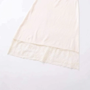 Elegant beige knitted midi skirt with intricate floral lace trim hem for casual wear