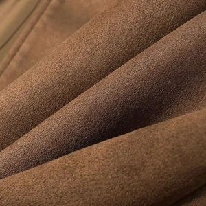 Detailed macro view of the premium brown faux suede fabric showing soft velvet texture