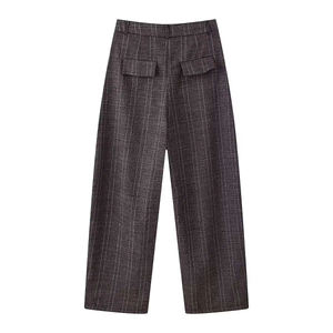 Detail view of the gray plaid pattern and rear flap pockets on these high-waisted wide-leg trousers