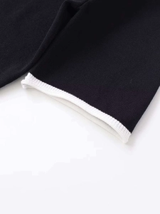 Close-up of knit fabric texture with high-density fibers and white contrast trim edge
