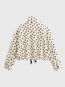 Detail of sherpa fleece texture with heart pattern and adjustable drawstring hemline