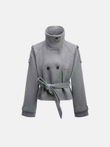 Detail of grey wool coat with high funnel neck, epaulettes and double-breasted closure