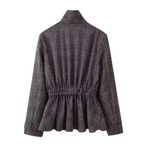 Women's plaid jacket with peplum waist and balloon fit trousers set on white background