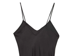 Detail shot of black silk satin slip dress with thin straps and a minimalist V-neck design