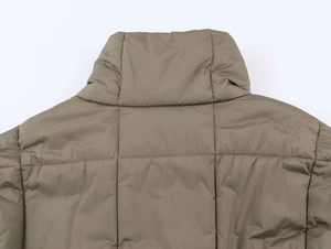 Detail of high-quality quilted fabric and stitching on khaki stand-collar puffer jacket