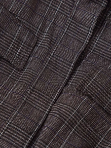 Macro view of Glen Check fabric with blue and white accents for premium outerwear texture