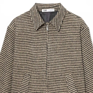Classic houndstooth bomber jacket with shoulder pads and metal zipper closure