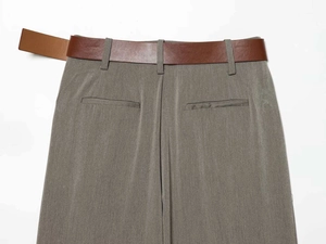 Detailed back view of high-waist wide-leg trousers with leather belt and welt pockets