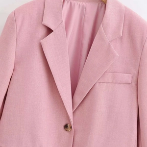 Elegant pink notch lapel blazer for women with single brown button and textured fabric