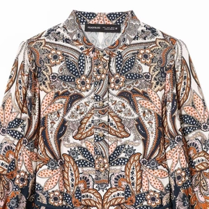 Women's waist-cinched shirt dress featuring paisley print and lantern sleeves