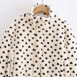 Women's white fleece high neck jacket featuring black heart polka dots and side pockets