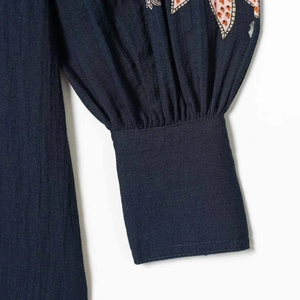 Women shirt dress with lantern sleeves featuring ethnic embroidery on dark blue fabric
