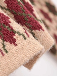 Detailed macro view of the soft knitted texture and retro argyle pattern on a cardigan