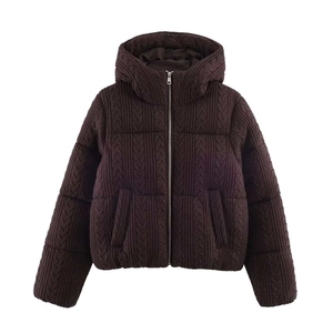 Close-up of dark brown cable knit texture on women's hooded puffer jacket with zipper