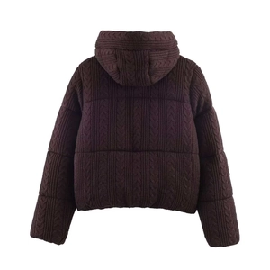 Back view of brown cable knit hooded puffer jacket with quilted texture for women