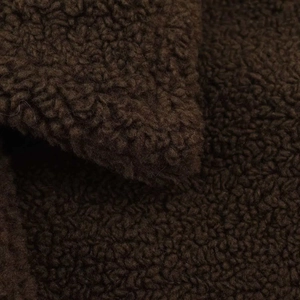 Close-up of deep brown teddy fleece fabric texture on a warm winter coat