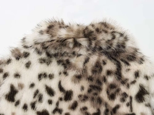 Close-up of leopard animal print faux fur collar with thick black and grey texture