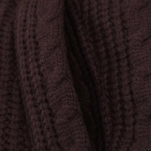 Macro shot of dark brown ribbed knit fabric texture on this stylish winter cotton jacket