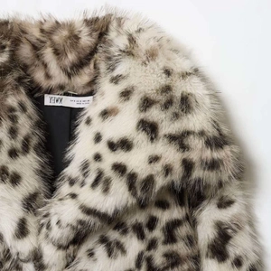 Elegant faux fur leopard print coat with plush animal texture and classic lapel collar
