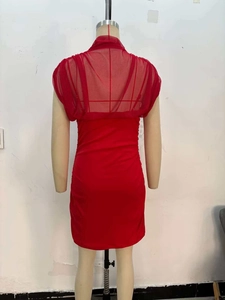 Detail view of red mini dress featuring mesh patchwork and pleated back texture