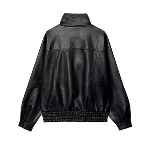Detailed back view of vintage black faux leather jacket with high collar and ribbed hem
