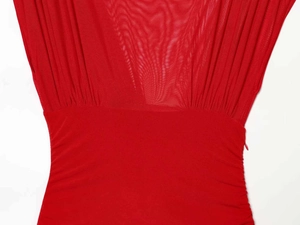 Detail of red sleeveless dress with ruched mesh patchwork and a concealed side zipper
