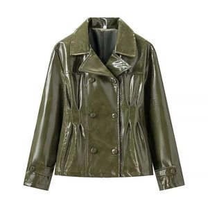 Detail of dark green patent leather jacket showing cracked texture and double-breasted buttons