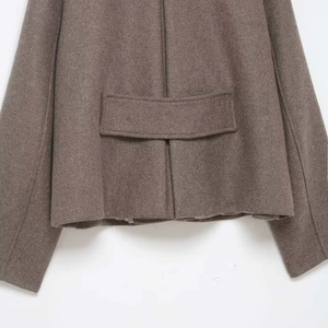 Classic brown wool blend jacket showing refined back stitching and decorative waist strap