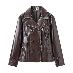 Detail of a shiny dark brown faux leather jacket with double-breasted buttons and lapels