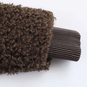 Detailed view of winter fleece jacket with warm textured sherpa and ribbed knit cuffs