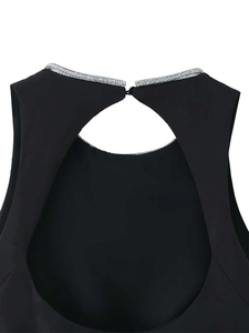 Detail shot of black sleeveless top featuring silver rhinestone trim and teardrop cutout